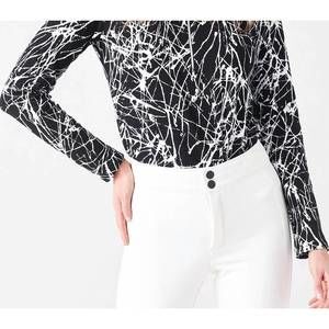 NEW SNO SKINS sport jacquard zip neck top in black/white